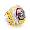 A close-up of a championship ring featuring gold and diamond accents with the word Capitals engraved on it.