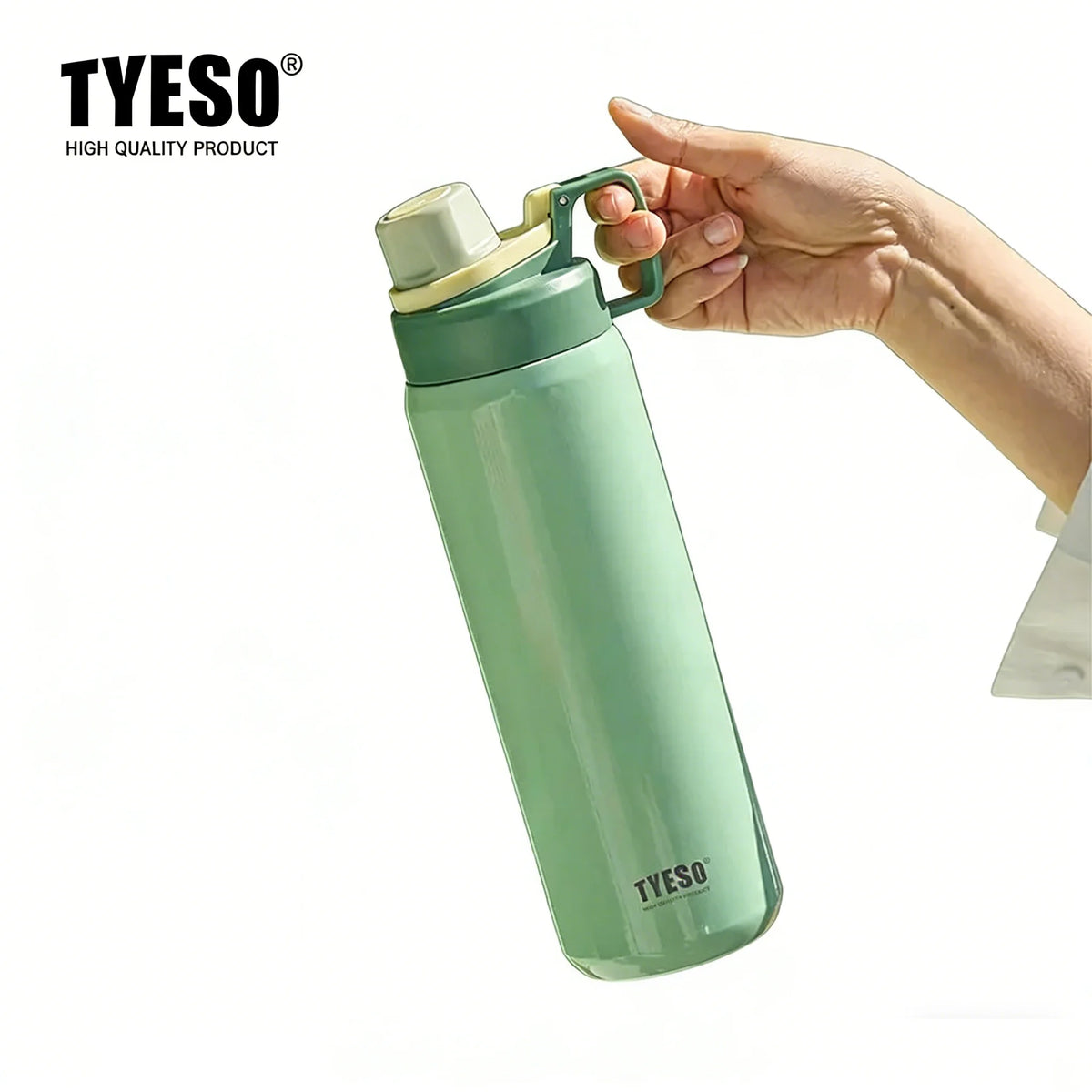 A hand is holding a light green insulated stainless steel water bottle with a silver cap.