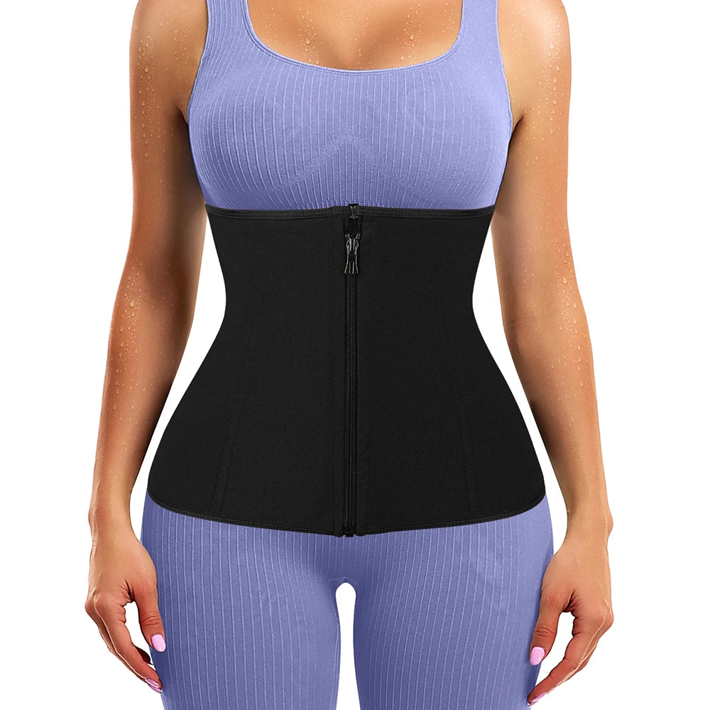 A woman wearing a black body shaping waist trainer corset over a light purple top and matching pants.