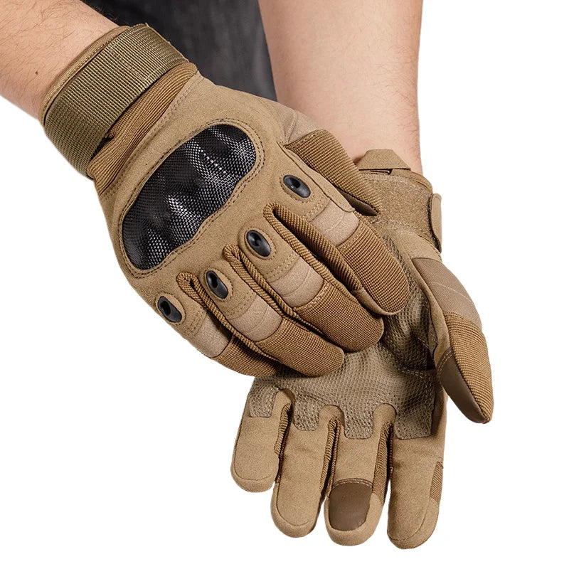 A close-up of tactical full finger gloves in olive green leather with a mesh palm and wrist strap.