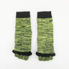 Pair of colorful five-finger yoga socks with black cuffs and neon green textured fabric