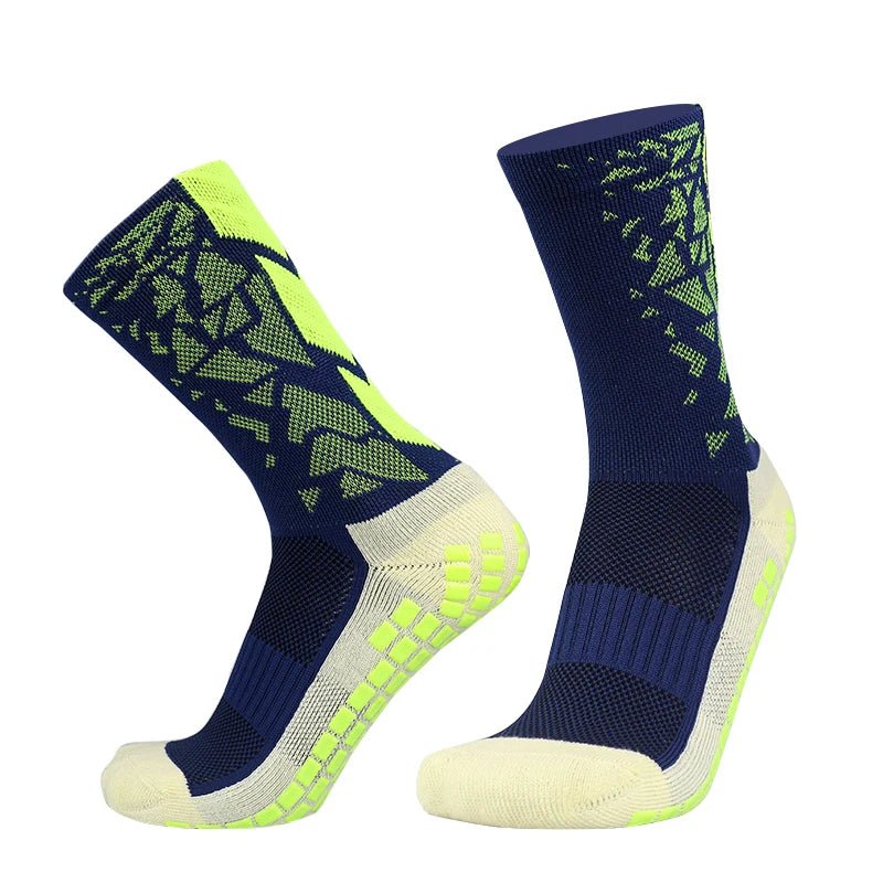 A pair of navy blue and neon yellow anti-slip silicone football socks shown from the side.