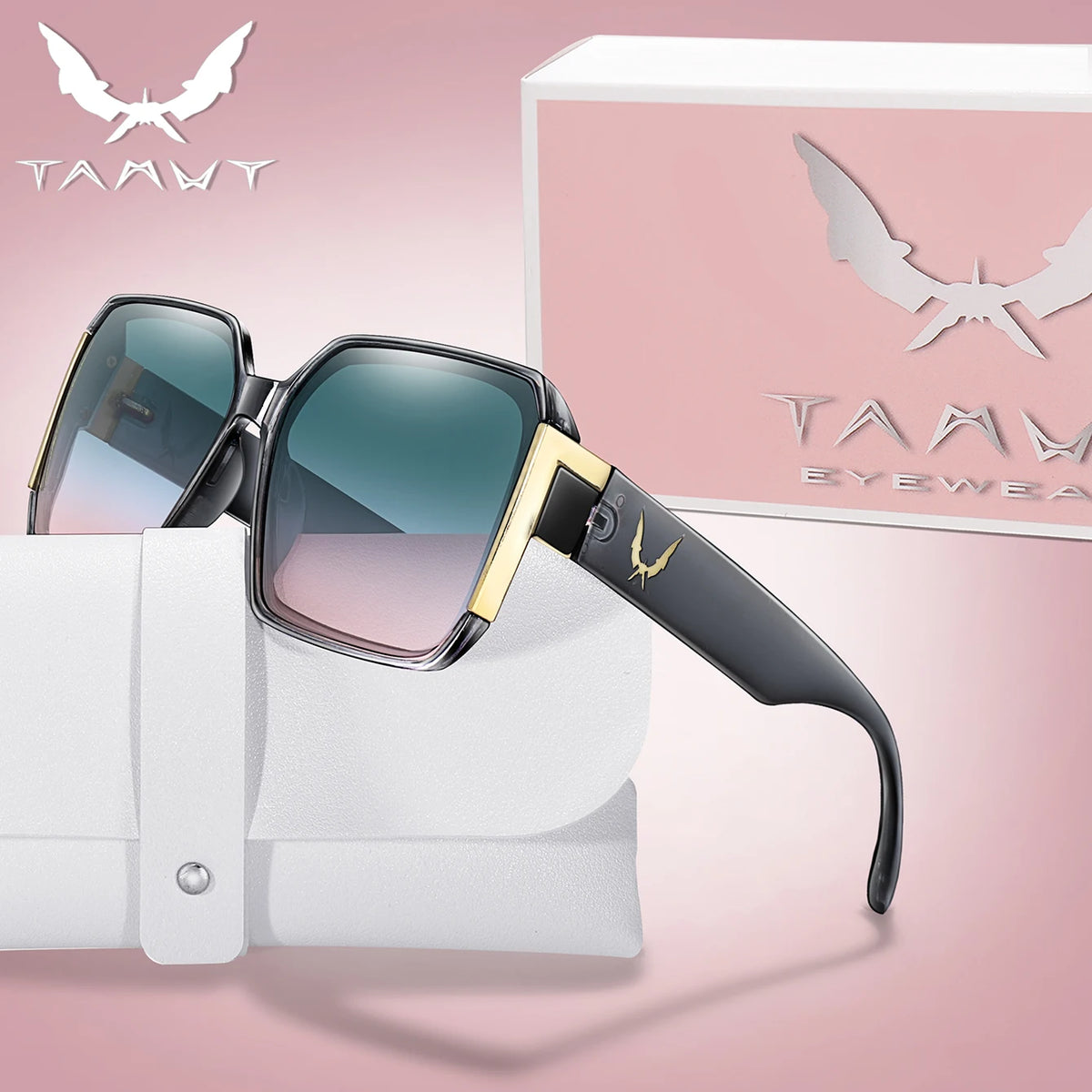 A pair of black and gold trendy square sunglasses resting on a white fabric background next to their packaging box.