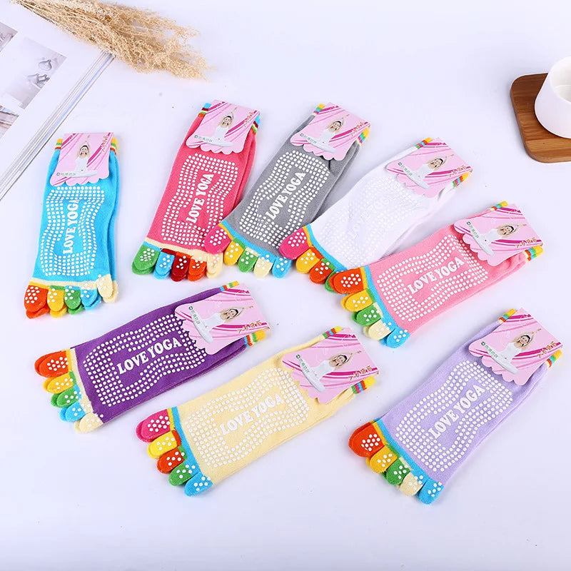 A collection of colorful yoga socks featuring various patterns and designs for dance and fitness.