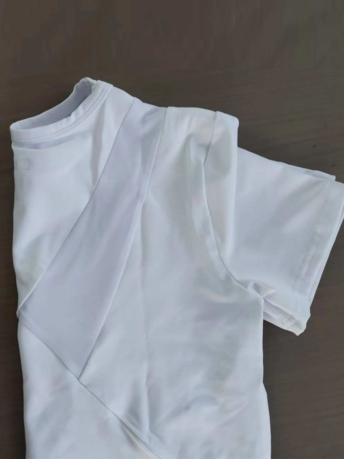 White women's breathable summer yoga and fitness t-shirt shown from the front.