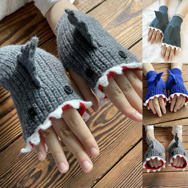 Gray knitted half finger gloves shaped like a shark fish with white trim shown on hands.