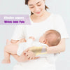 A woman is supporting a baby's wrist with a gold compression strap to alleviate joint pain.