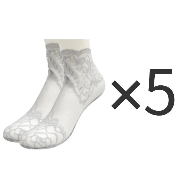 Five pairs of white lace mesh ankle socks displayed on a white background.
