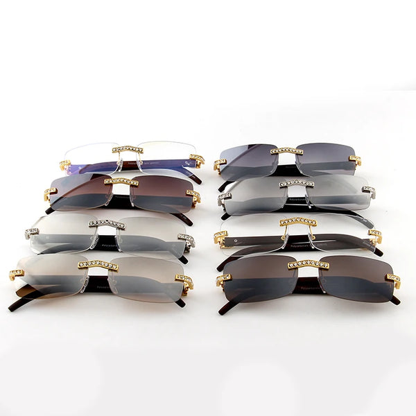 A collection of vintage rhinestone rimless sunglasses in various shades of gray and brown.
