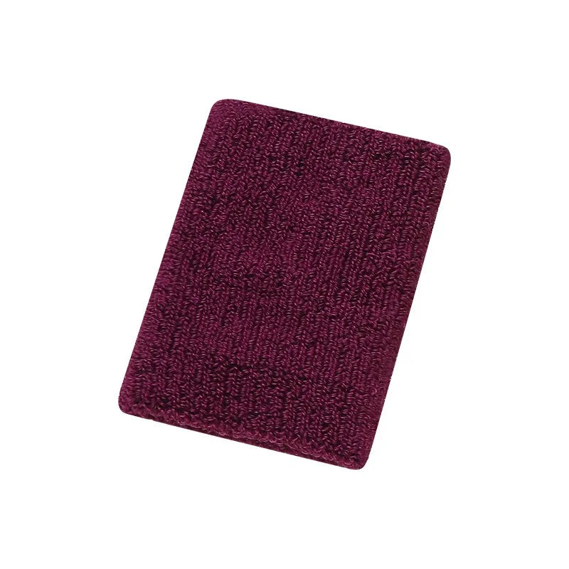 A dark magenta knitted wristband for activewear.