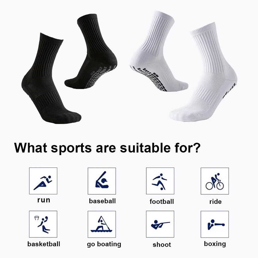 A set of black and white athletic grip socks shown in various styles for sports performance.