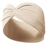 A beige fabric yoga headband tied in a voluminous knot, shown from the side.