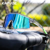 A pair of blue polarized sports sunglasses with a clear frame resting on a black bicycle handlebar.