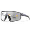 A pair of clear photochromic sports sunglasses with a gray frame and yellow sun icon.