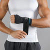 A person wearing a white tank top is shown holding a black VaoSi wrist palm support brace on their forearm.