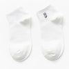 A pair of white cotton socks with a small embroidered cat design on the toe.