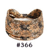 A close-up of a patterned, knotted cotton headband in earth tones for yoga or workout.