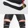 A pair of black, white, and red high-compression knee wraps are shown folded and a pair worn on the lower leg.