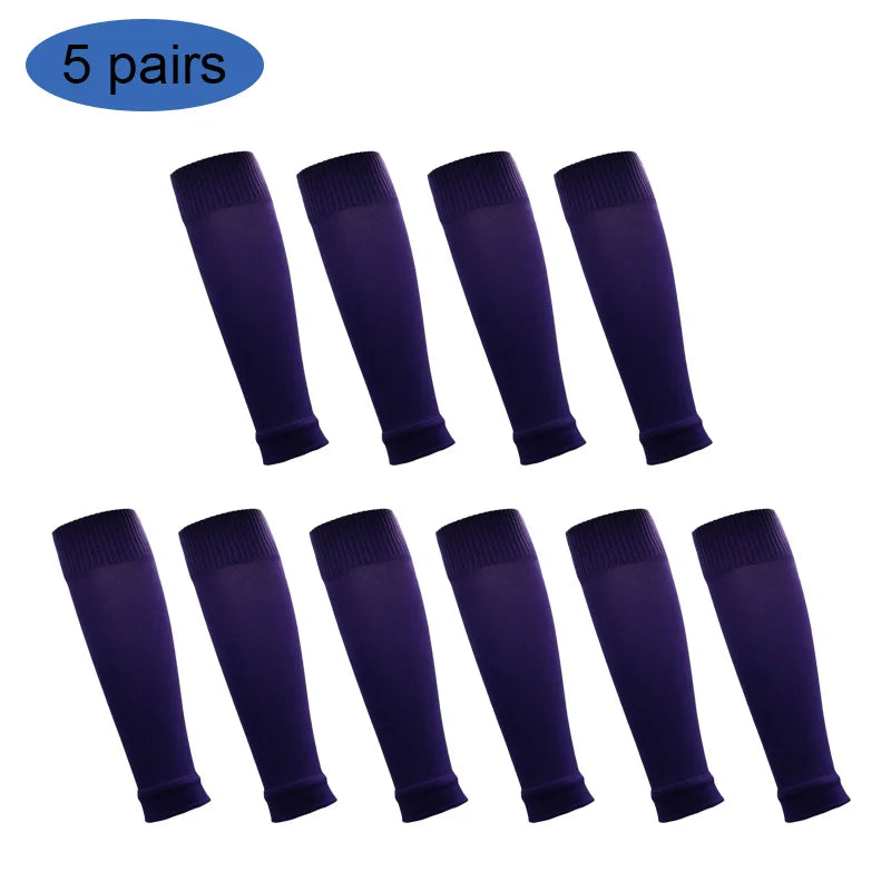 Five pairs of dark purple football shin guards for leg protection