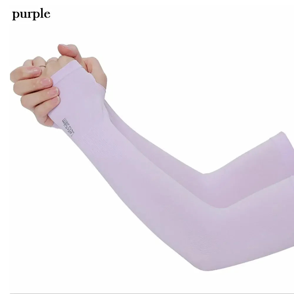 A purple long sleeve arm sleeve being held by a hand, demonstrating sun protection.