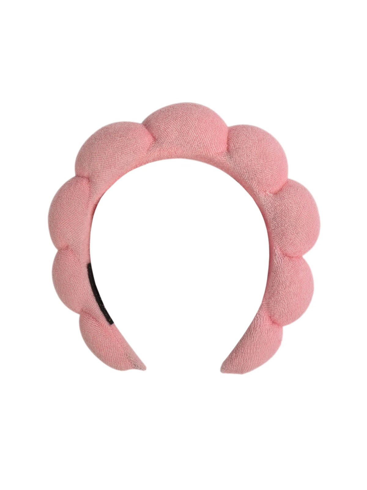A pink microfiber skincare headband and wristband set.