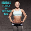 A smiling woman wearing a light blue sports bra and gray leggings, demonstrating an adjustable pelvic support hip belt.