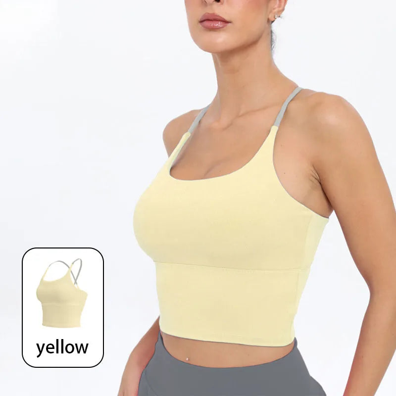 A model wearing a yellow summer strappy yoga sports bra top.
