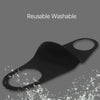 Black reusable washable face mask being washed with water.