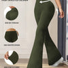 A model wearing olive green high-waisted yoga trousers, demonstrating the fit and features.