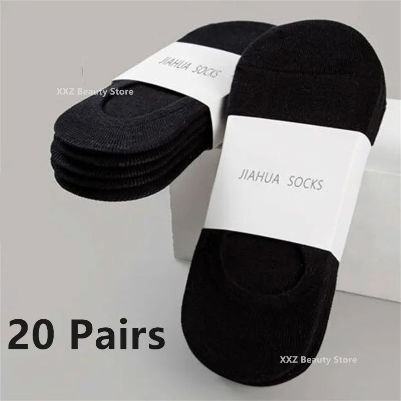 A stack of twenty pairs of black invisible silicone no-show boat socks with white labels.