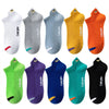 A collection of nine men's breathable ankle boat socks in various colors including white, gray, blue, yellow, and orange.