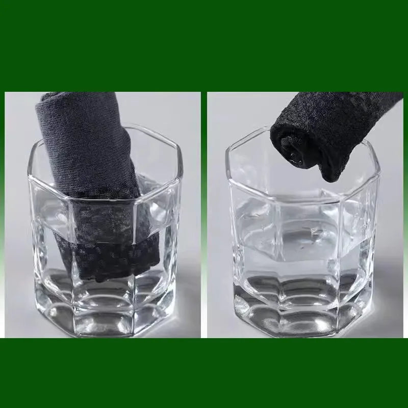 A clear glass container holds a rolled dark grey bamboo fibre anti-odor sock.