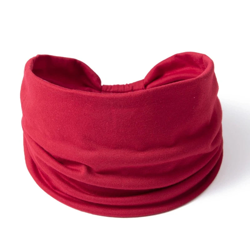 A deep red fabric headband or hair wrap for women