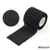 A black disposable anti-slip tattoo bandage is shown rolled and unfolded, with a circular view of the texture.