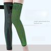 A pair of dark green non-slip elastic knee sleeves shown on a leg.