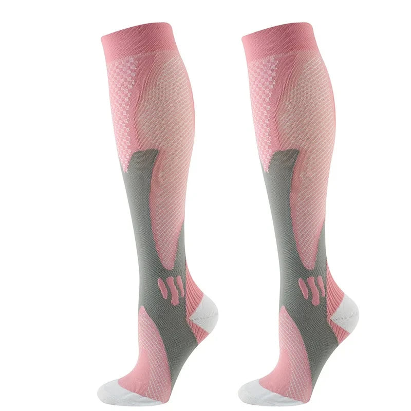 Pair of pink compression socks with grey accents for circulation and recovery