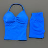 A bright blue women's seamless backless fitness set consisting of a cropped top and long sleeves.