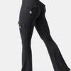A model is wearing high-waisted black flared fitness pants with functional pockets.
