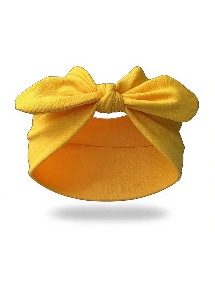 Un bandeau élastique jaune vif noué en nœud, montré sur fond blanc.
