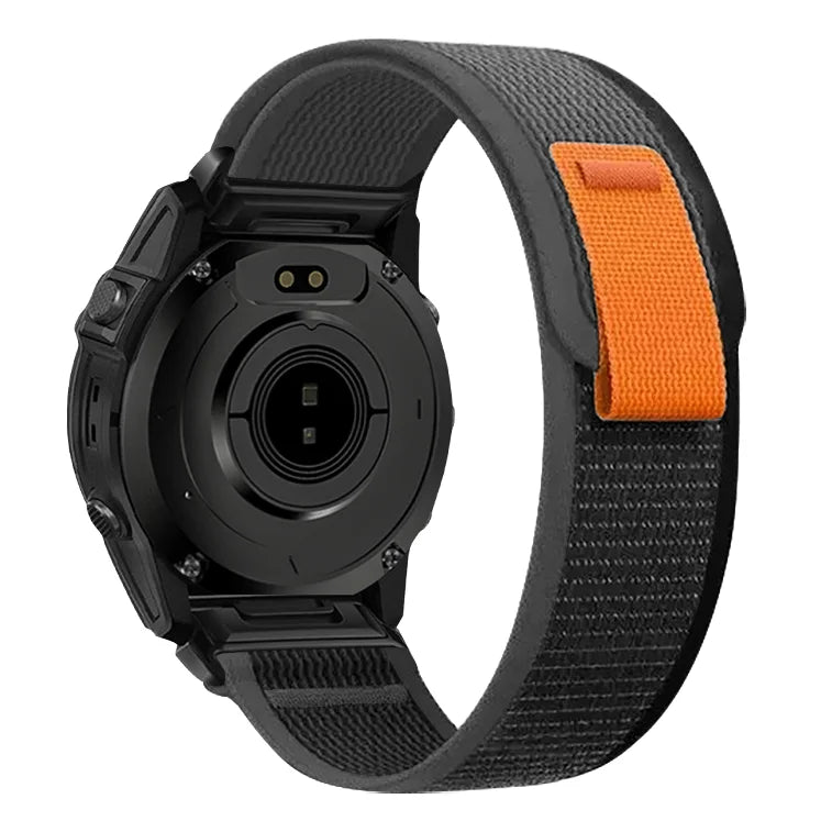A black Garmin sports watch with an orange nylon strap shown from the side.