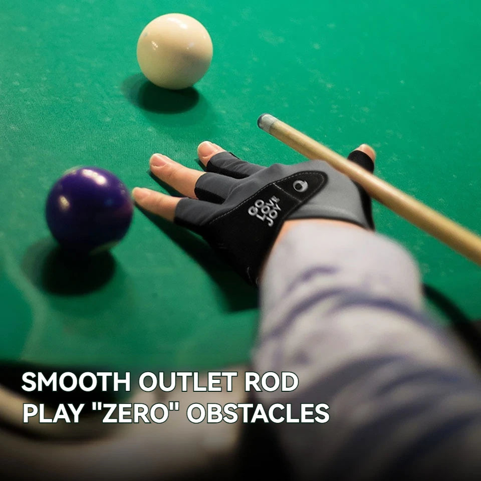 A hand wearing a black glove is using a smooth outlet rod to play pool on a green table with balls.