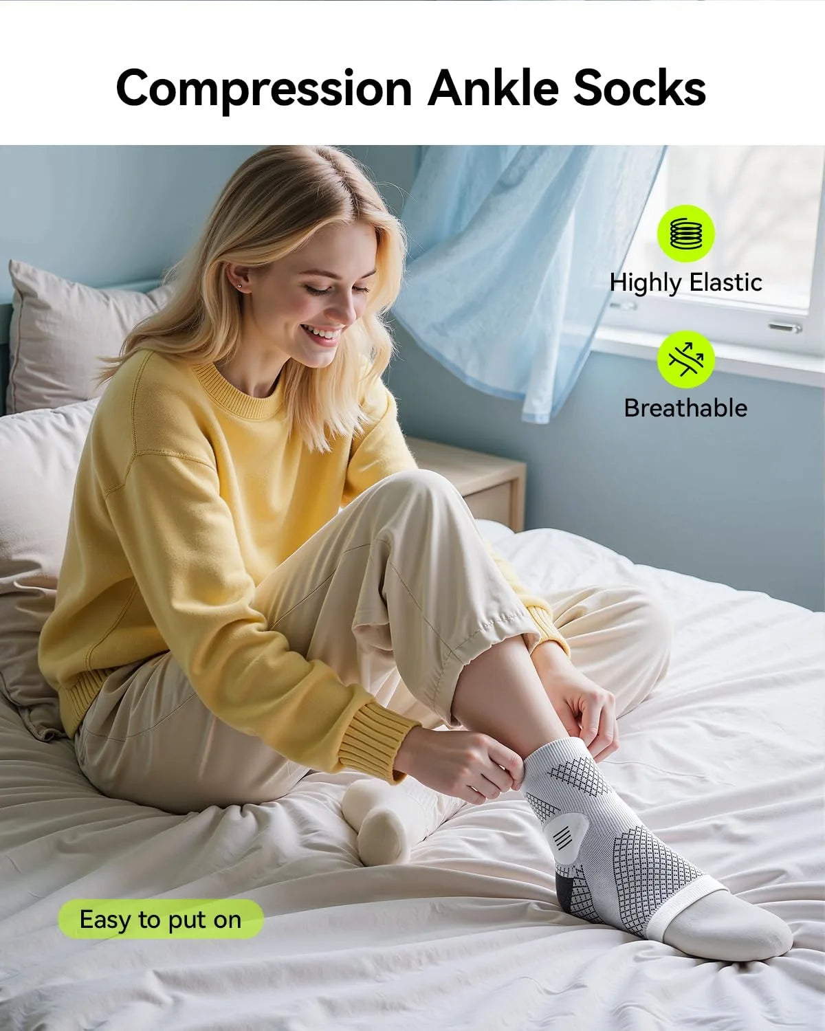 A woman wearing compression ankle socks is sitting on a bed, demonstrating the easy fit of the socks.