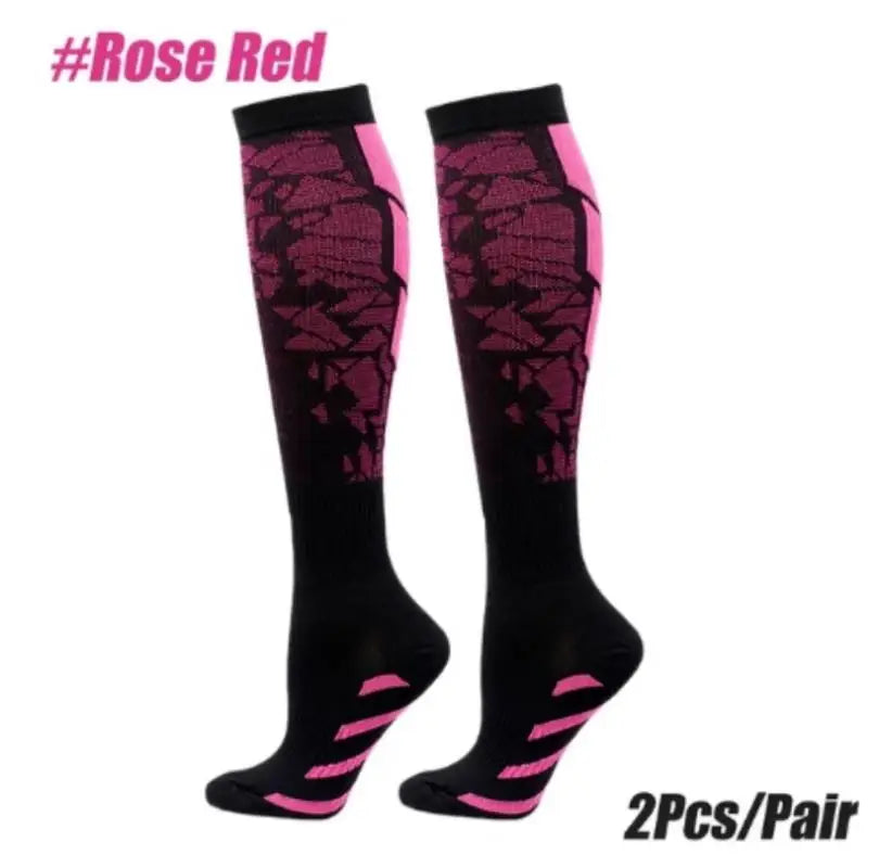 Pair of women's and men's sports compression socks in black with pink patterned accents