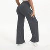 A person wearing dark gray NCLAGEN SoftMotion Straight Leg Yoga Pants standing and looking down.
