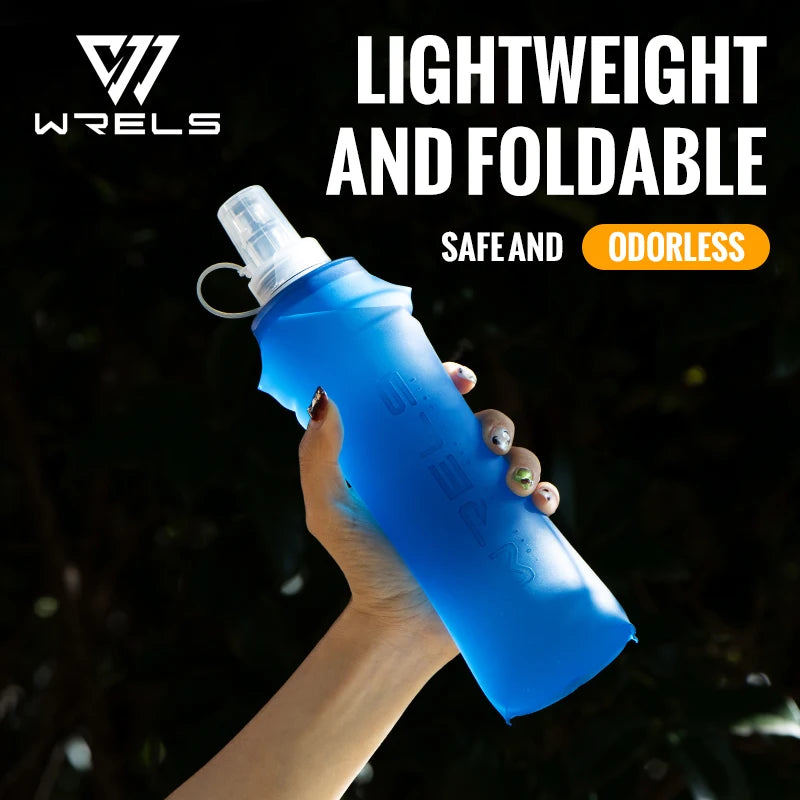 A hand holds a lightweight, foldable blue silicone hydration flask against a dark background.