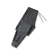 Black men's ice silk performance pants shown flat lay with drawstring detail