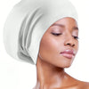 A model wearing a white silicone swim cap for long hair against a white background.