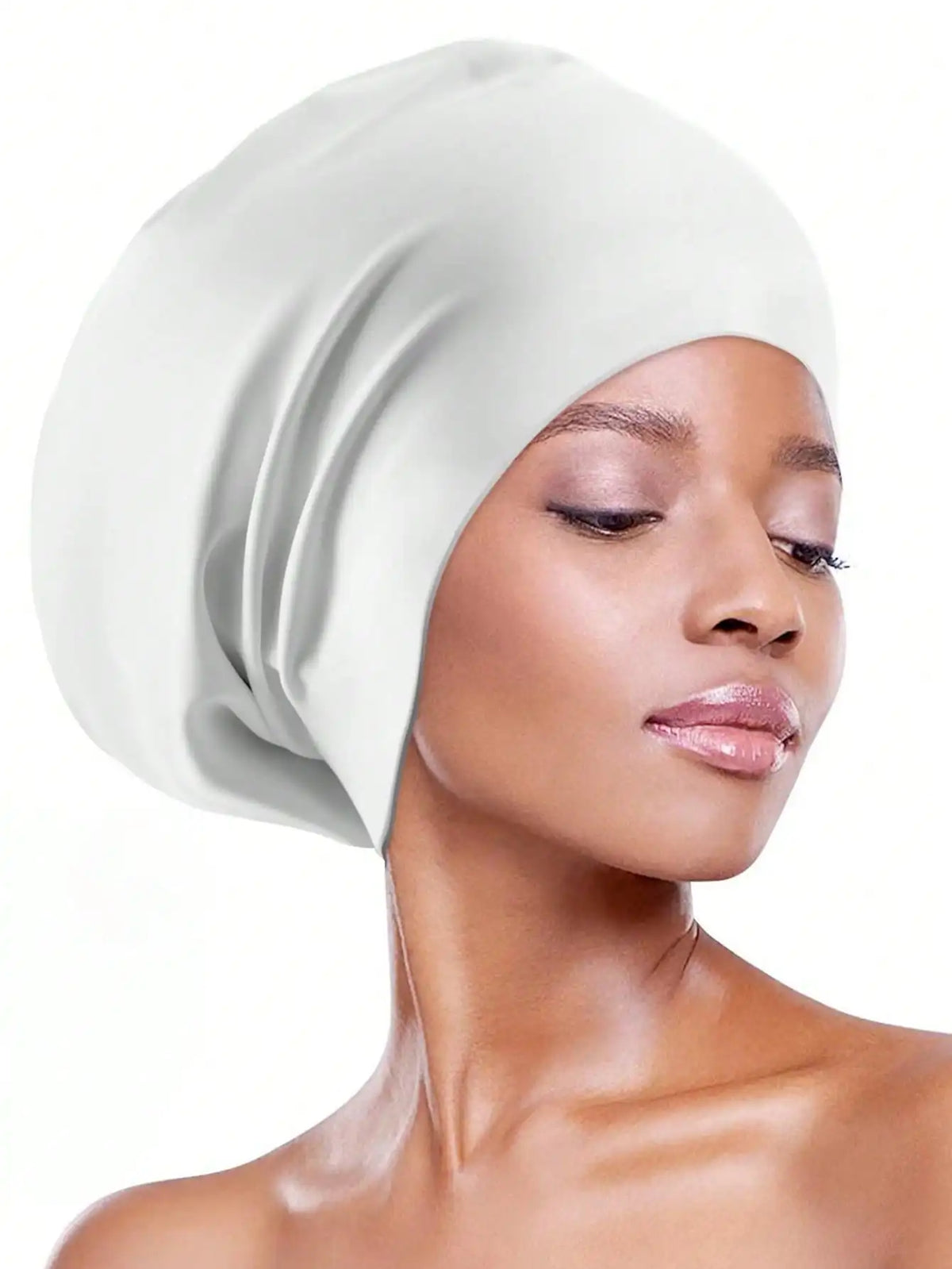 A model wearing a white silicone swim cap for long hair against a white background.