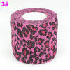 Roll of pink and black leopard print elastic bandage tape for joints