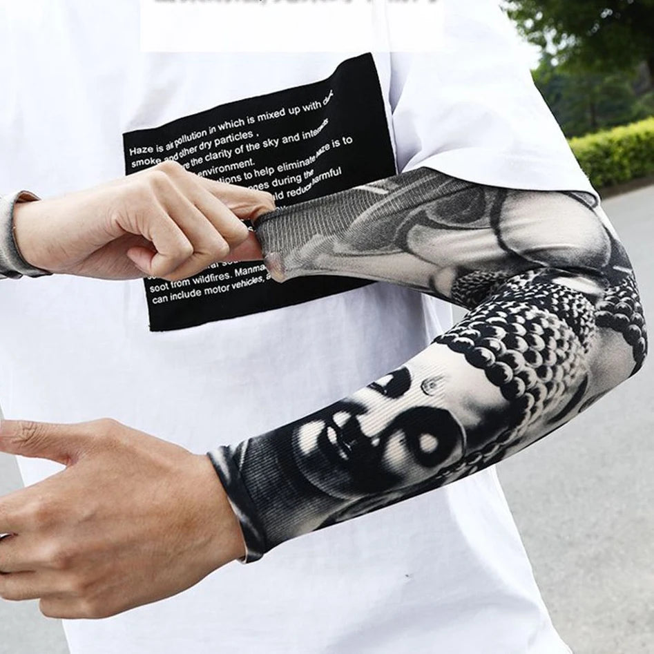 A person is holding a black informational sheet while wearing a black and white patterned ice silk tattoo sleeve on their arm